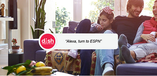 Family watching TV, giving Alexa a command to go to ESPN