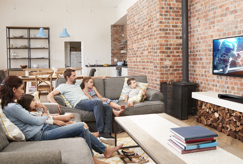 Family watching TV from the couch