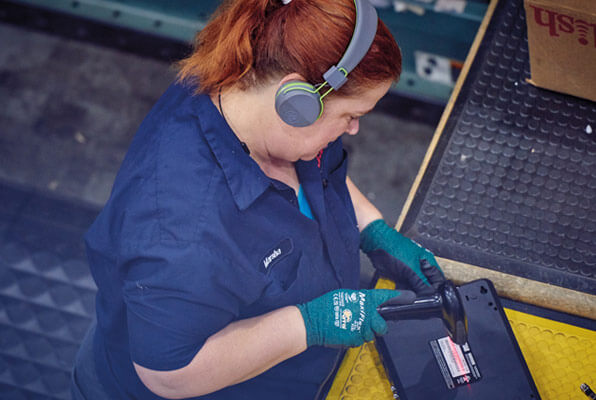 Technician recycling old electronics